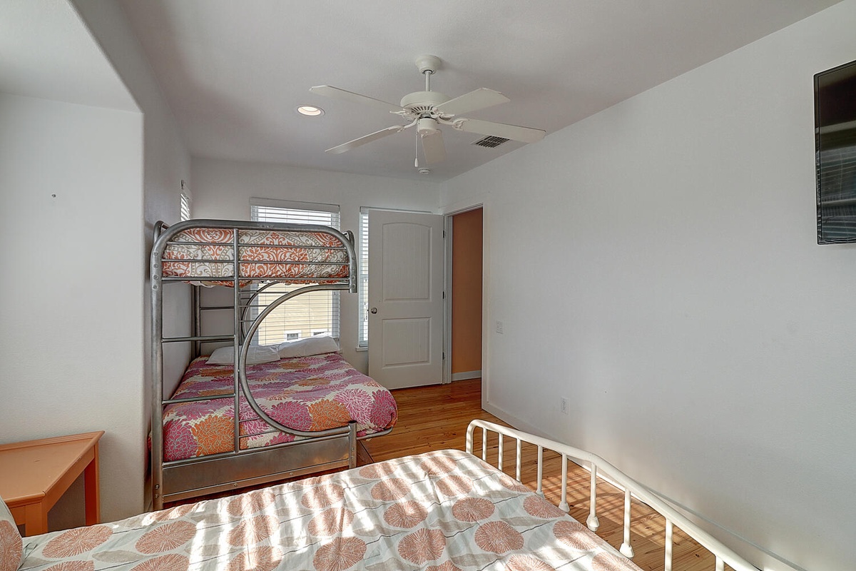 Your spacious bedroom features comfortable bunk beds and a separate single bed, perfect for families or friends traveling together.