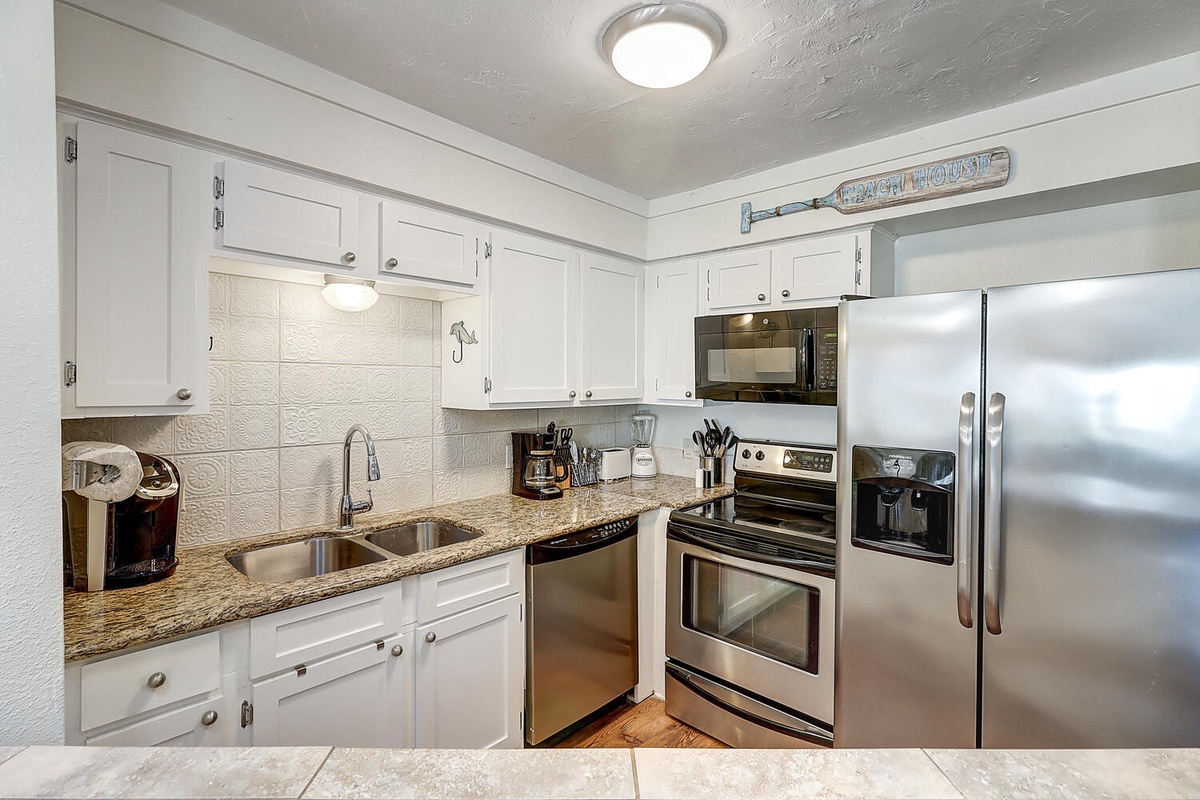 Your fully equipped kitchen features granite countertops, stainless steel appliances, and everything you need to create memorable meals during your stay.