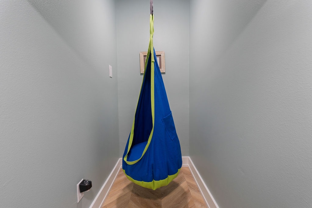 Your kids will love this cozy reading nook with a fun hanging chair that creates the perfect hideaway for quiet time and imagination.