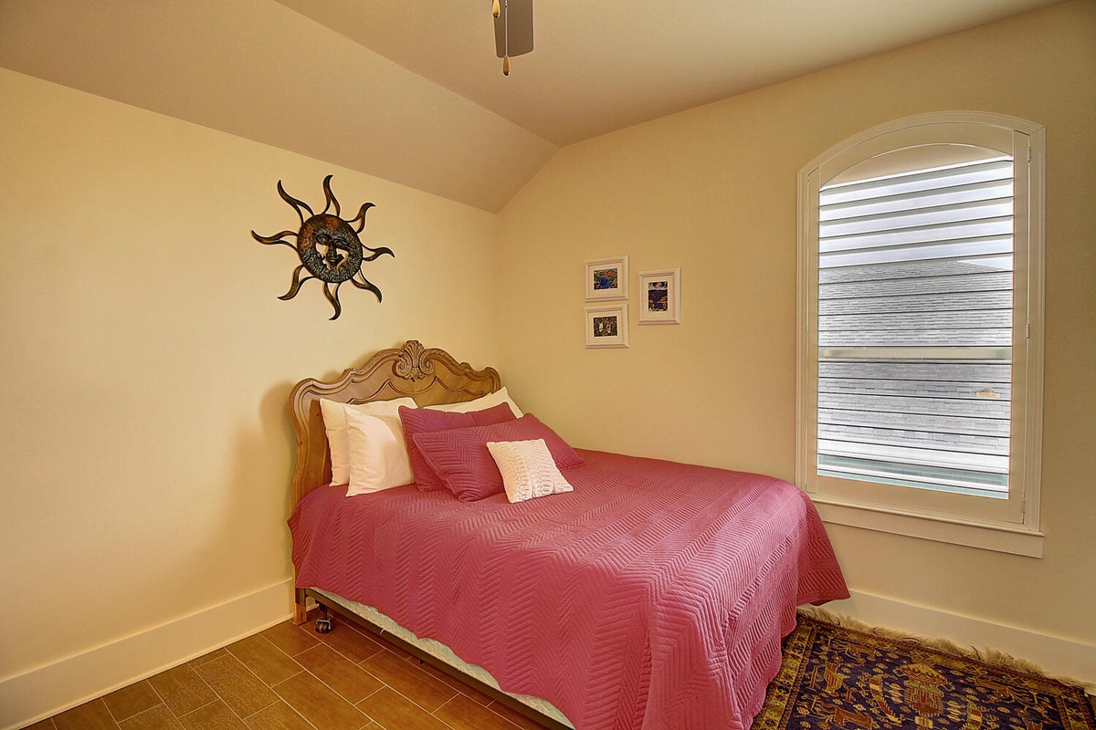 Rest peacefully in your comfortable bedroom with warm earth tones and charming decorative touches creating a cozy retreat.