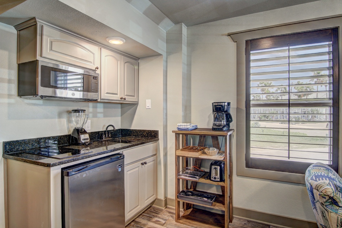 Your fully equipped kitchenette features granite countertops, stainless appliances, and everything you need to prepare meals in comfort.