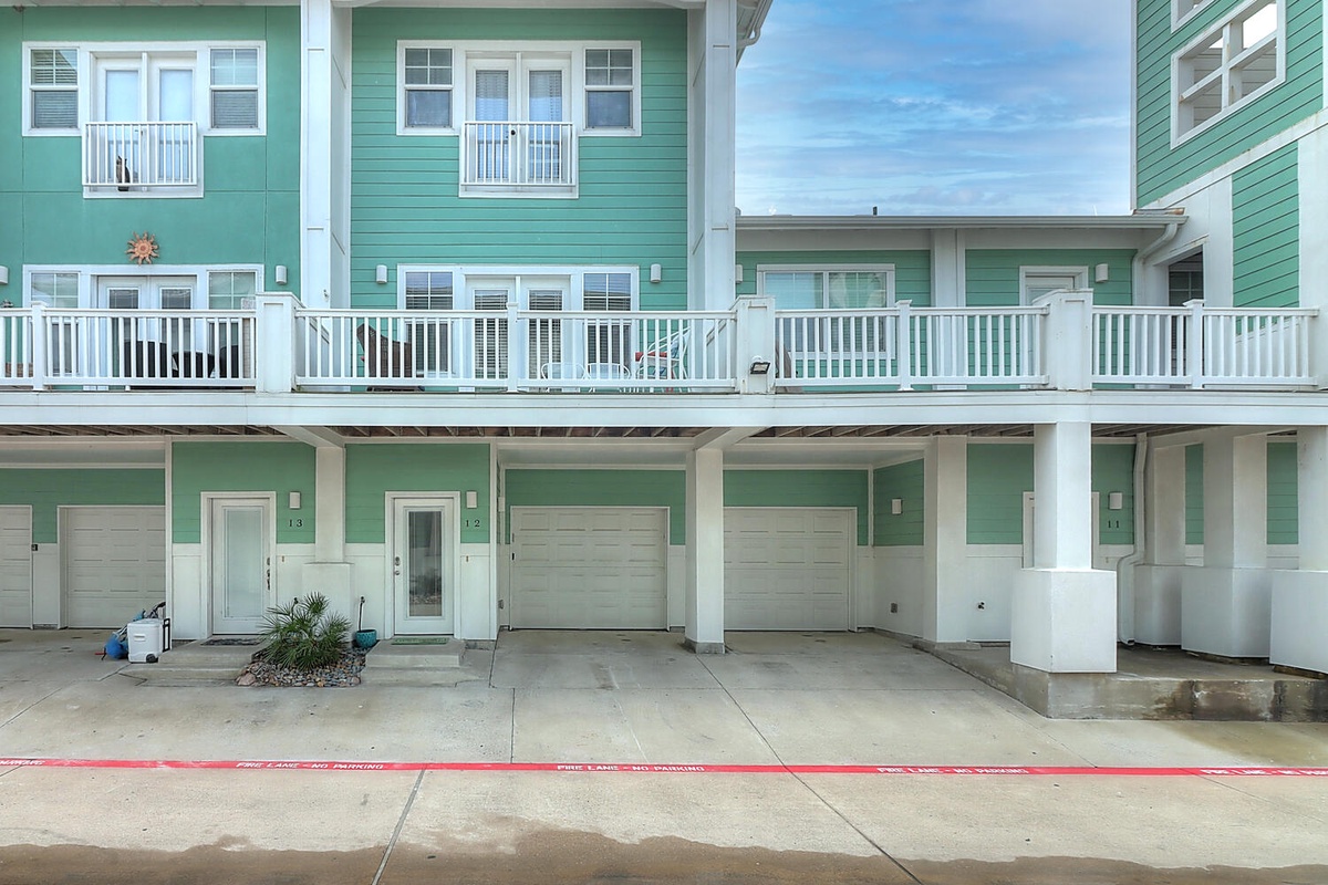Multi-story vacation rental building with convenient ground-level parking and private entrances to each unit.