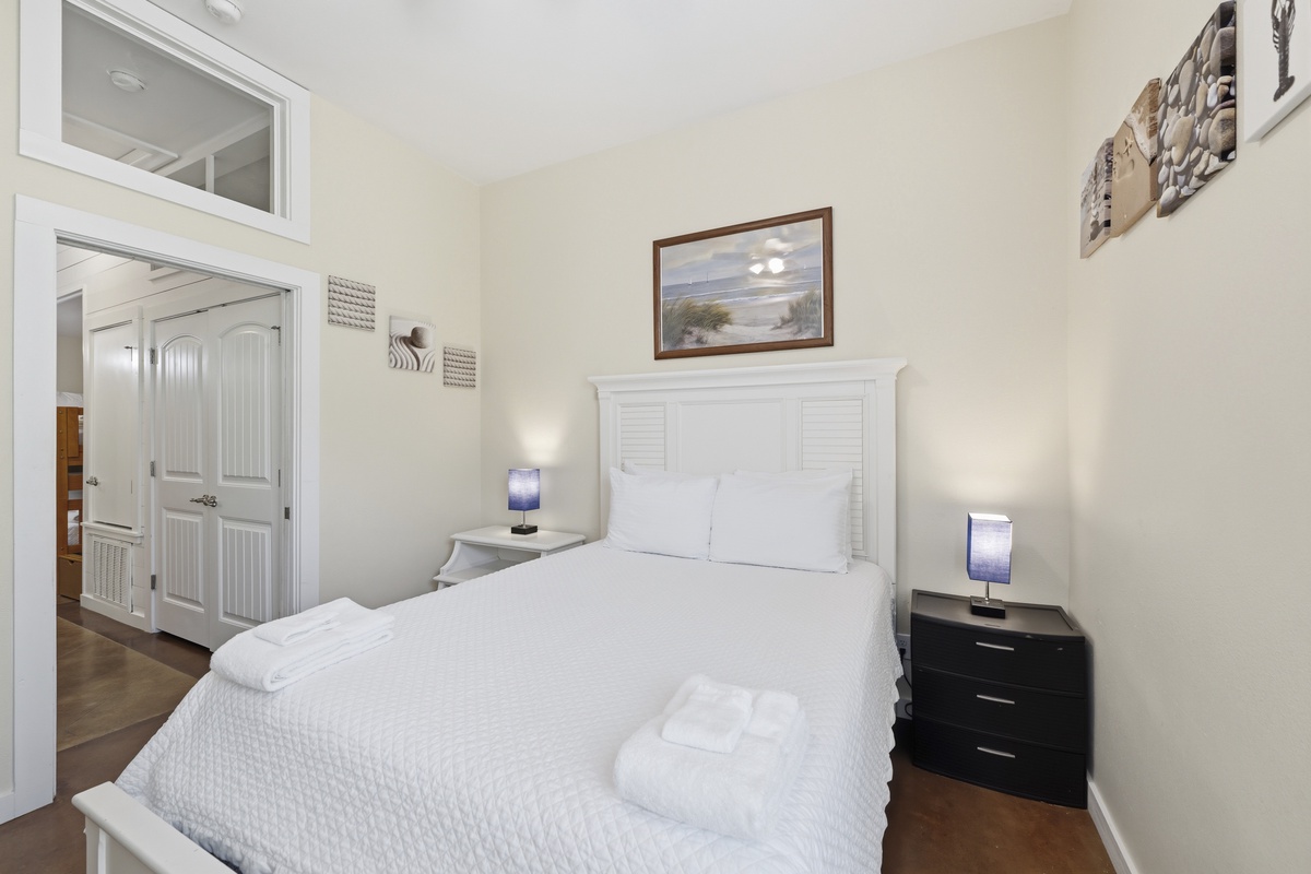 This bright and airy retreat blends crisp white linens with classic coastal accents, creating a soothing space to relax and recharge.