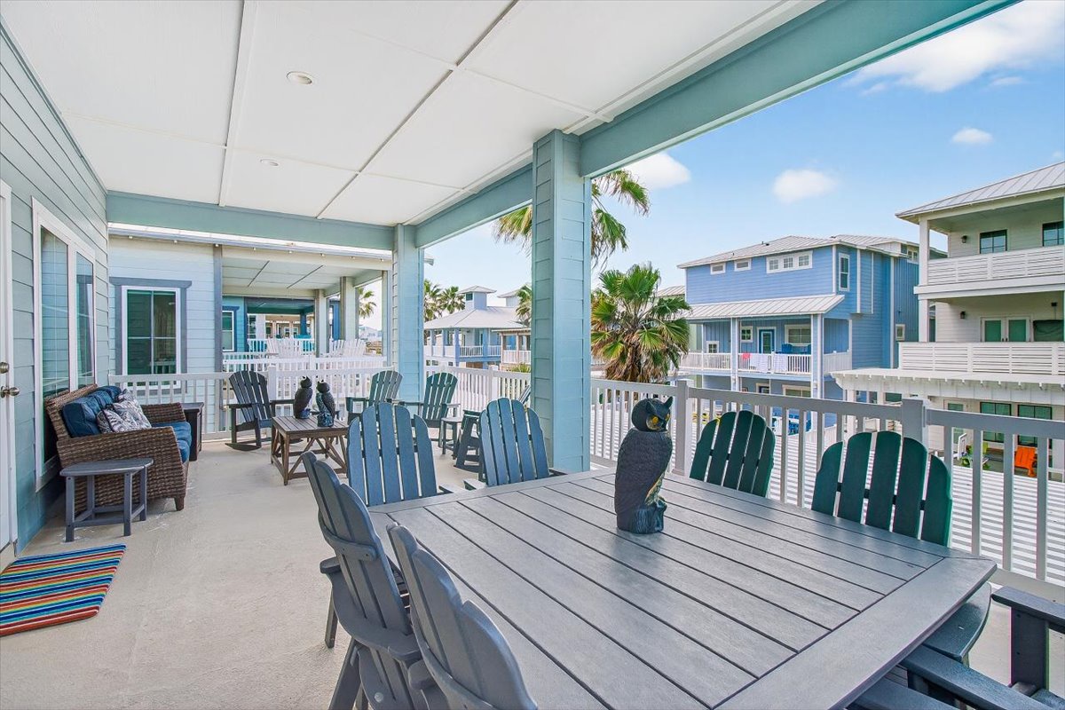 Your spacious covered balcony offers the perfect spot to dine al fresco while enjoying tropical breezes and colorful neighborhood views.