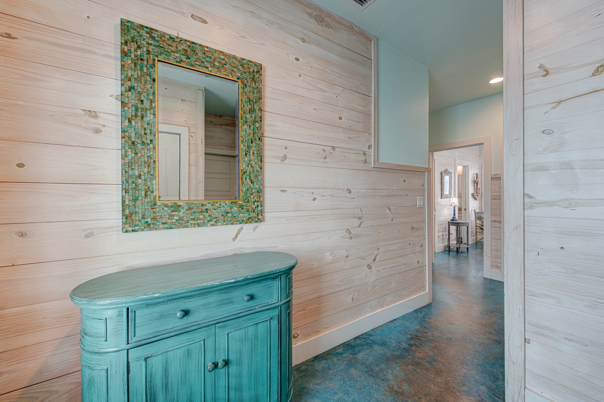 Relax in your stylish coastal retreat with stunning mosaic details and warm wood accents that create a peaceful escape.