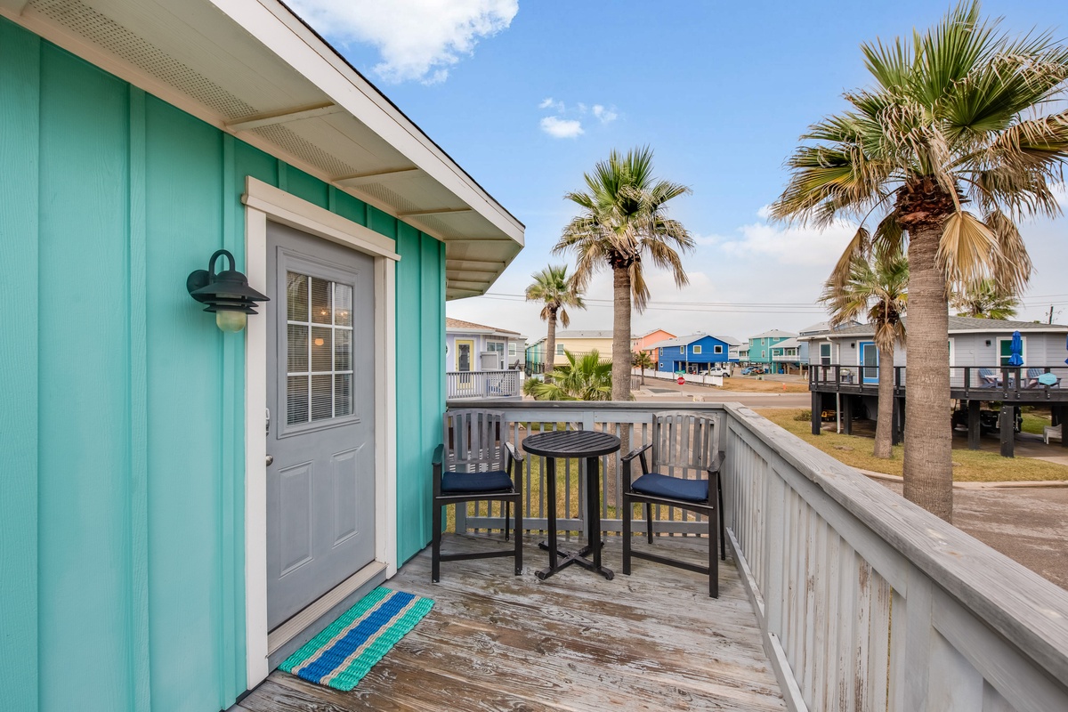 Step onto your private deck where coastal breezes meet tropical charm, complete with bistro seating to savor morning coffee.