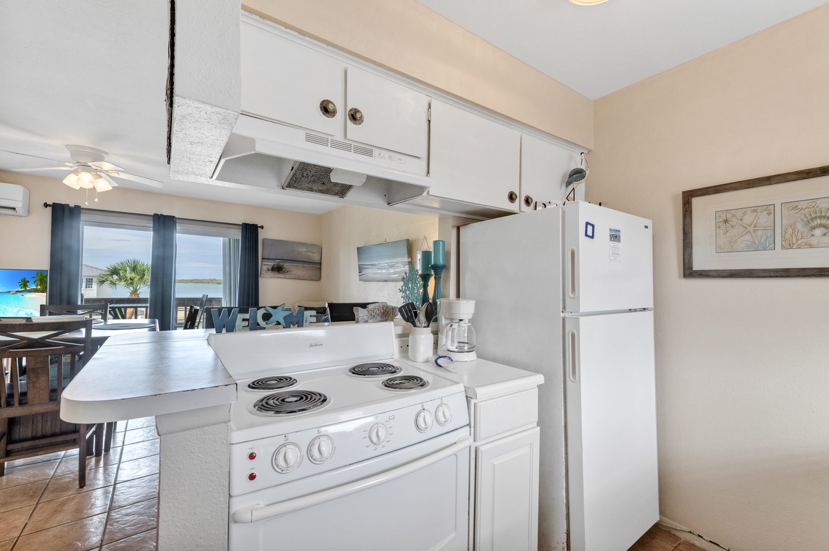 Your fully equipped kitchen features modern appliances and opens to stunning ocean views, making meal prep a delight.
