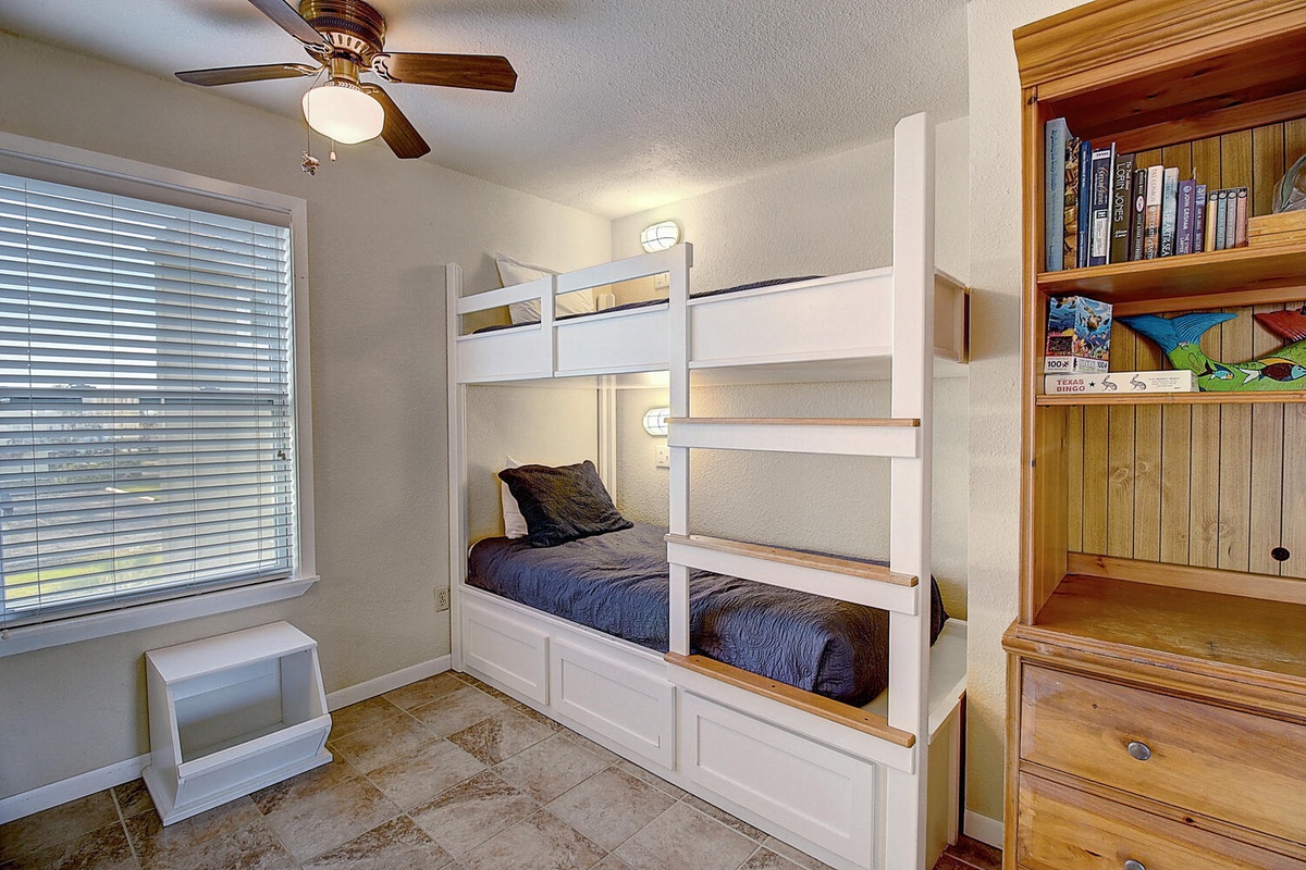 Cozy bunk beds with reading lights create perfect sleeping spots for your group, with books nearby for bedtime stories.