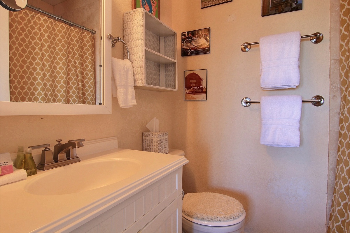 Step into your cozy bathroom with vintage charm and modern comfort—fresh towels await your arrival.