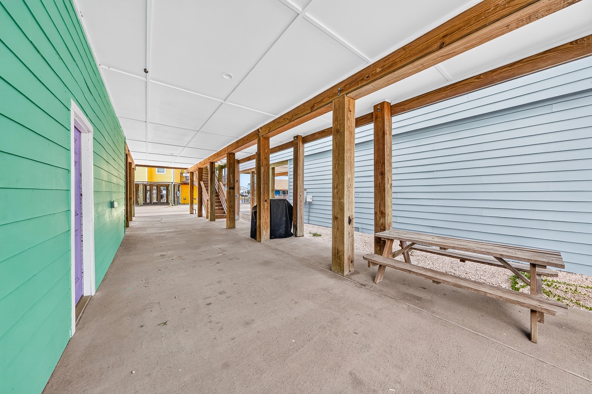Covered ground-level parking offers convenient space beneath the home with easy access to the property.