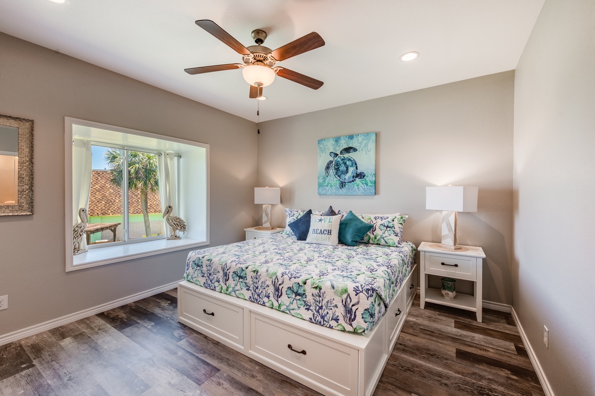 Wake up refreshed in your coastal-themed bedroom with comfortable storage bed and tropical views through your private window.