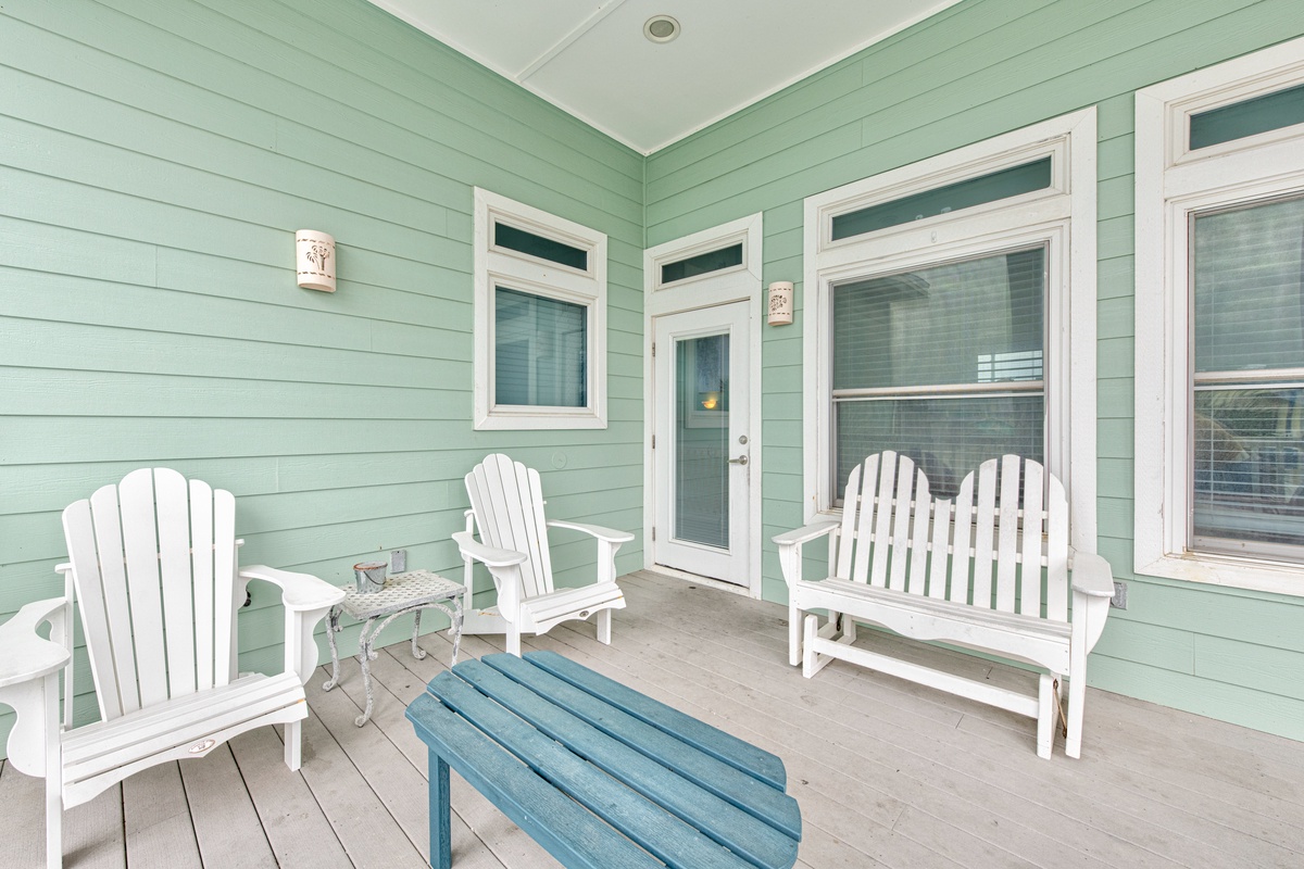 Unwind on your private porch with classic Adirondack chairs and coastal colors that invite peaceful relaxation.
