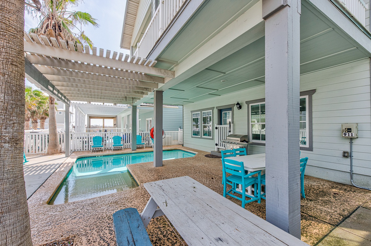Your private poolside paradise awaits with covered dining and lounge areas perfect for memorable vacation moments.