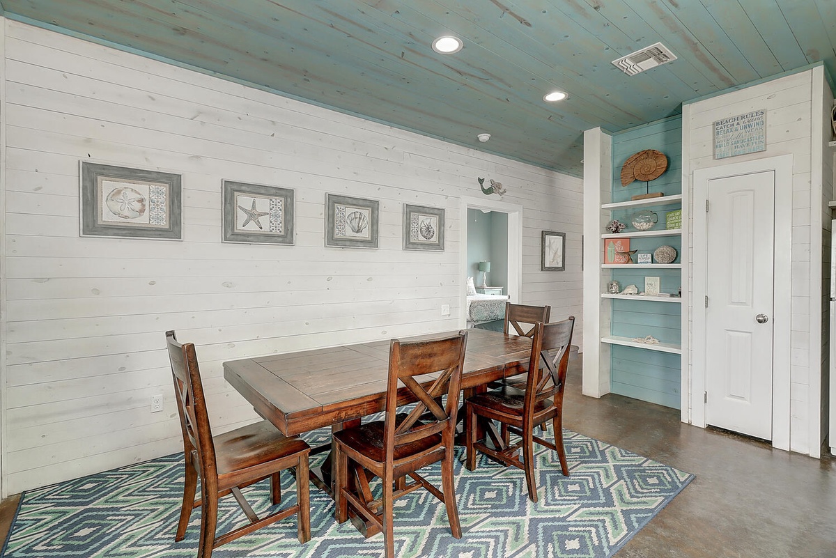 Your coastal dining space blends rustic charm with seaside elegance—perfect for memorable meals together.