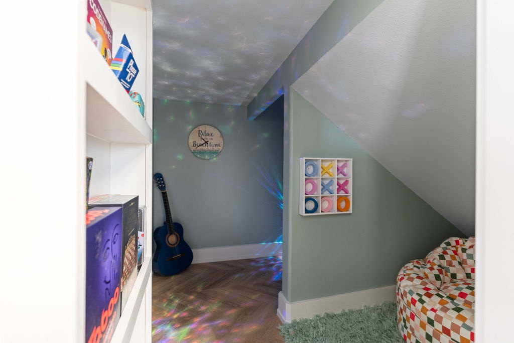 Step into your own colorful game room, where disco lights dance on the walls and a guitar awaits your next melody.