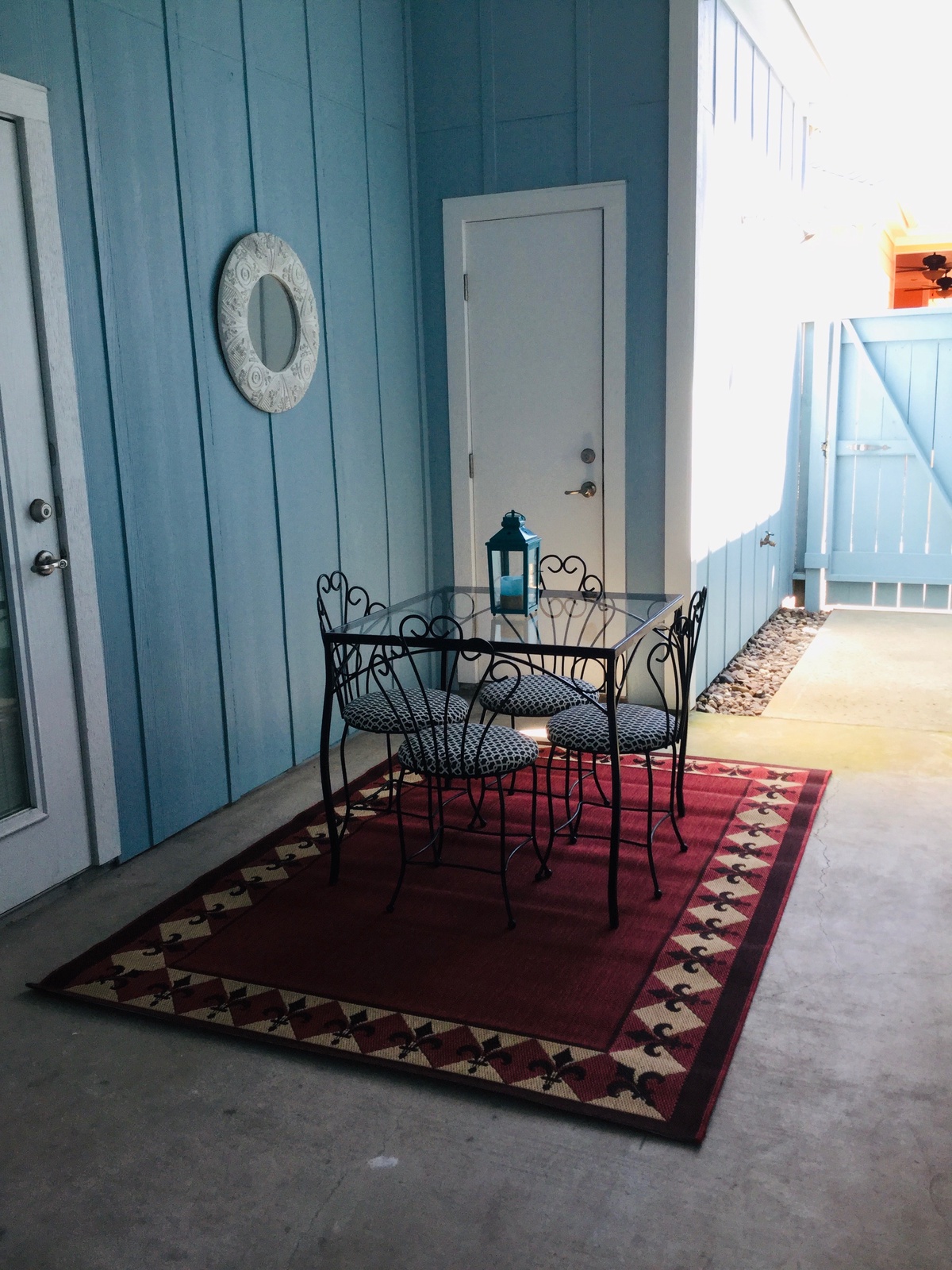 Relax at your private bistro table on the covered patio, where charming coastal decor creates the perfect spot for morning coffee or evening conversations.