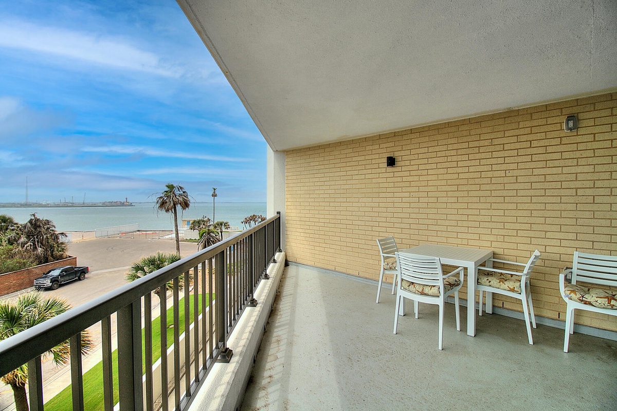 Your private balcony offers stunning sea views where you can sip morning coffee while watching palm trees sway and boats drift across sparkling waters.