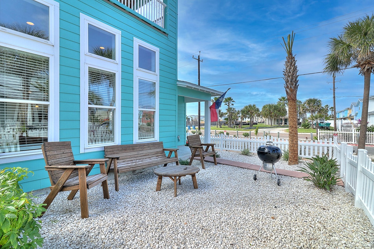Unwind on your private patio with comfortable seating and BBQ, perfect for grilling while soaking in tropical coastal vibes.