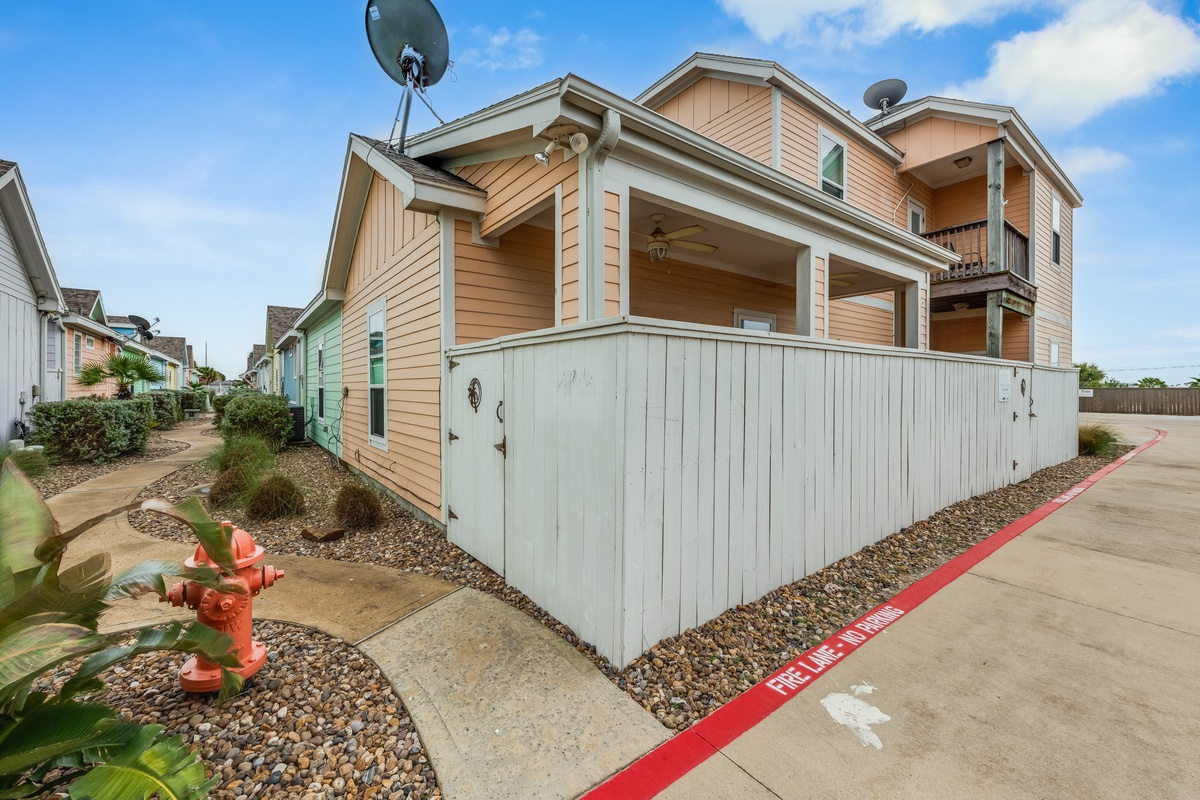 Charming coastal cottage with private outdoor space featuring a covered porch where you can unwind after beach adventures.