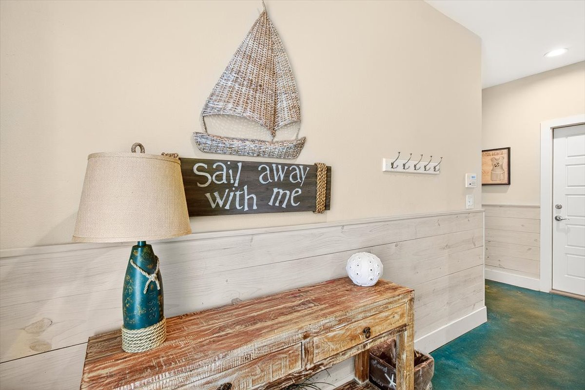 Your coastal escape awaits with charming nautical decor and weathered wood accents that instantly transport you to seaside serenity.