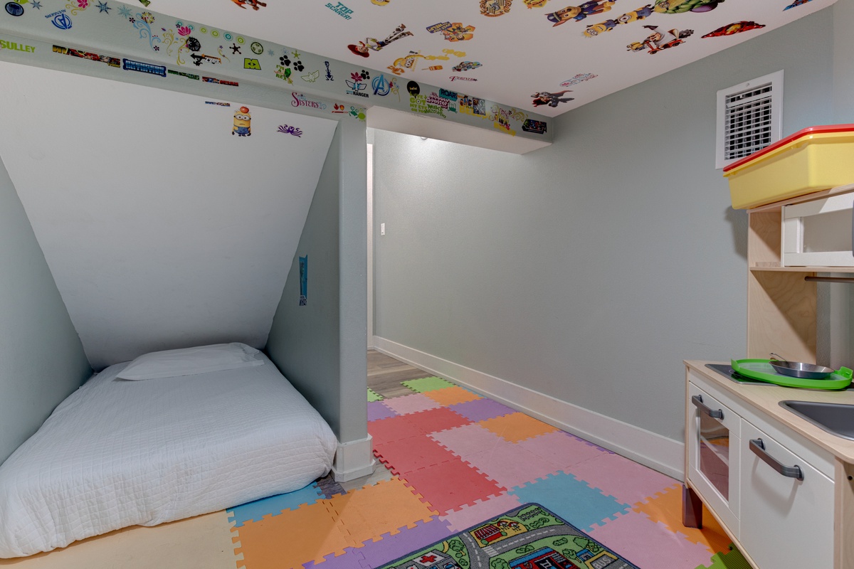 Your kids will love this magical hideaway with colorful foam flooring, fun ceiling stickers, and their own play kitchen for endless adventures.