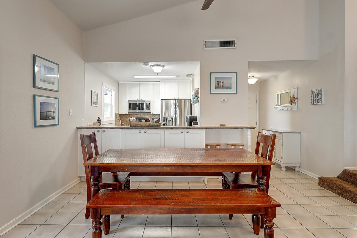 Gather around your spacious dining table where family meals become cherished memories, with a fully equipped kitchen ready for your culinary adventures.