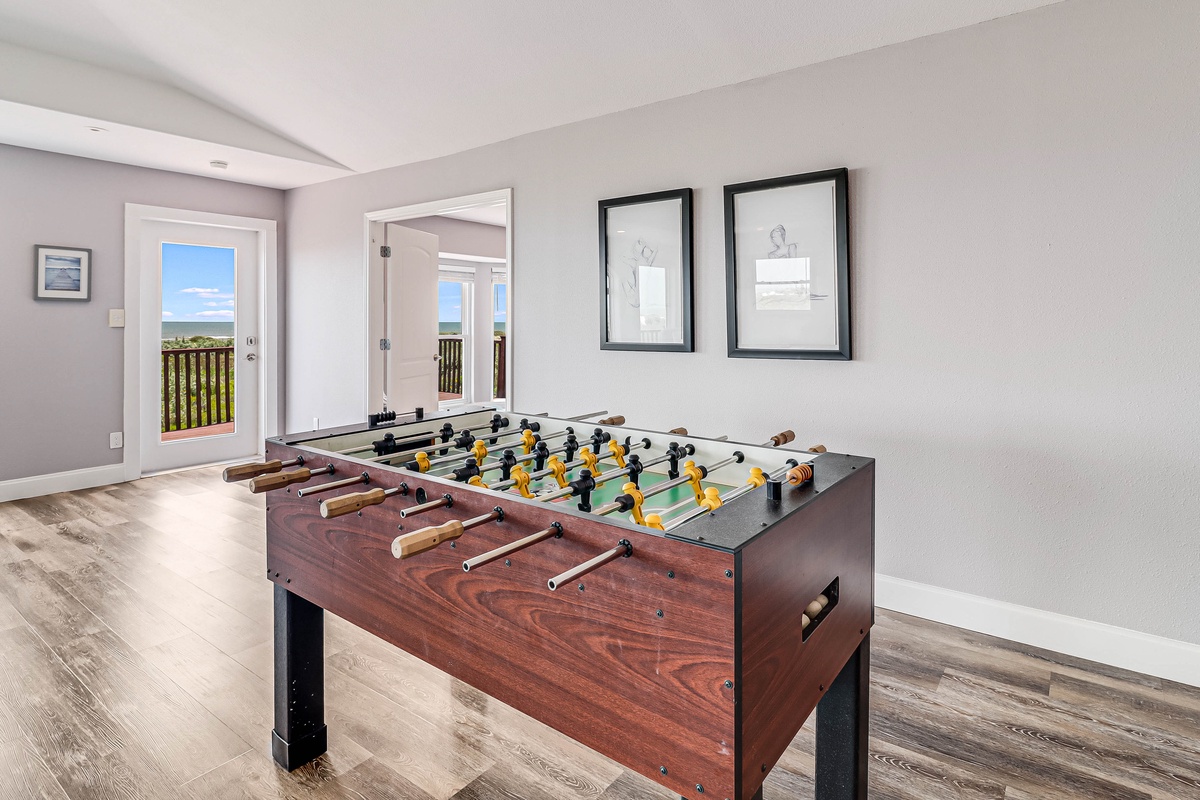 Challenge friends to a game of foosball in your bright game room, complete with balcony access for fresh air breaks.