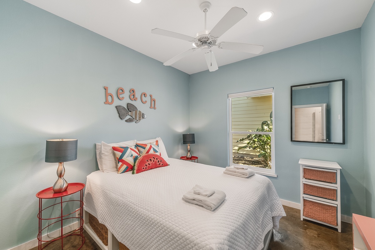 Drift into coastal dreams in your cheerful beach-themed bedroom with crisp linens and refreshing ocean-blue walls.