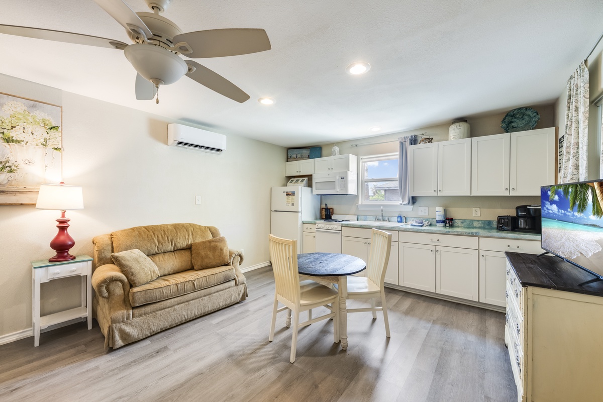 Your bright, open living space combines a full kitchen and cozy seating area—perfect for morning coffee or unwinding after a beach day. A/C and ceiling fan keep you comfortable.