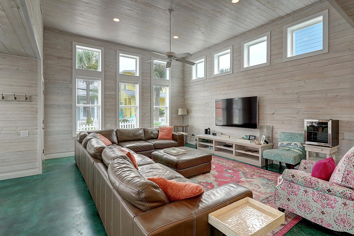 Sink into this inviting leather sectional and feel instantly at home in your spacious living room with soaring ceilings and abundant natural light.