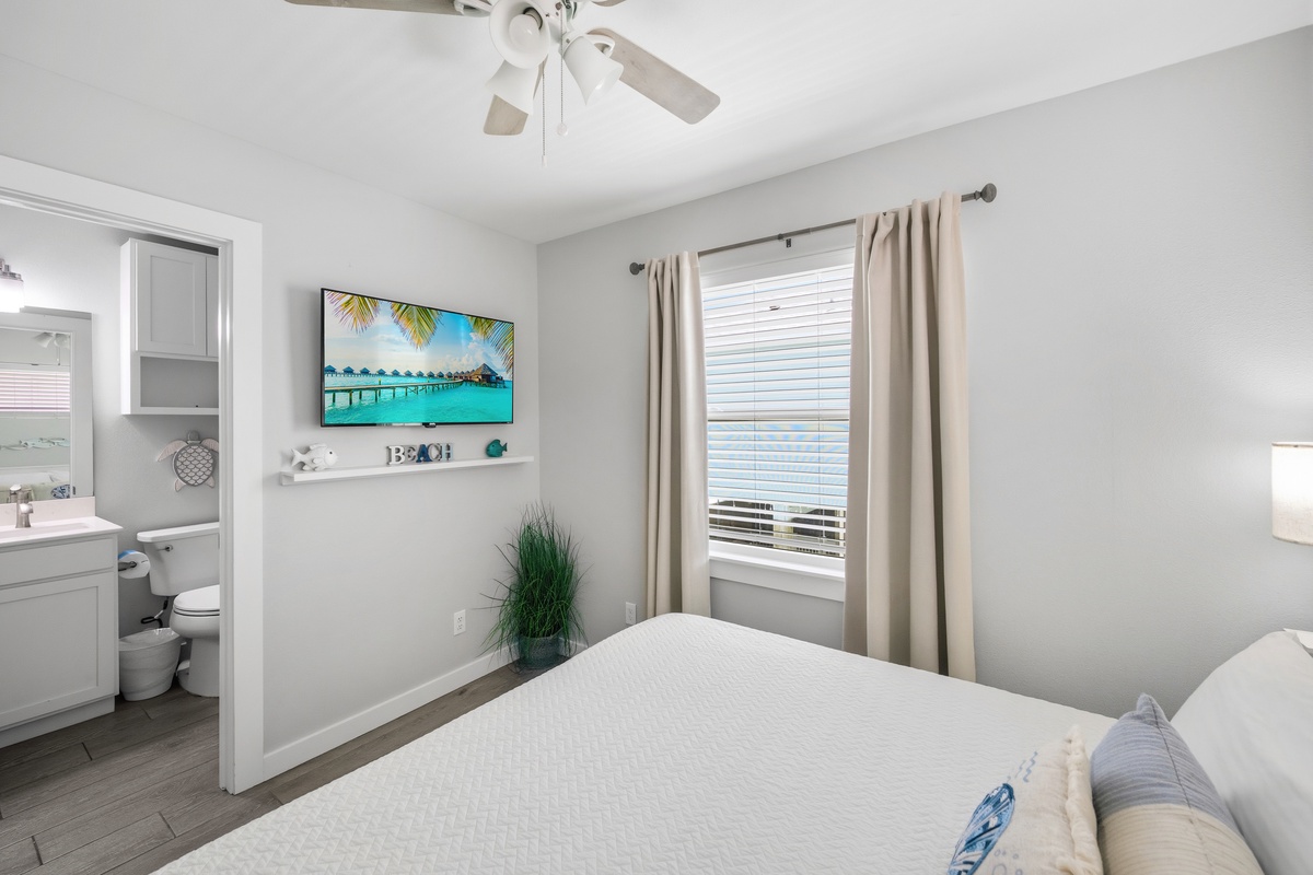 Sink into the soft, inviting bed and unwind in your private oasis. Natural light filters through your window, while the ceiling fan adds a gentle breeze. Your en-suite bathroom is just steps away for ultimate convenience.