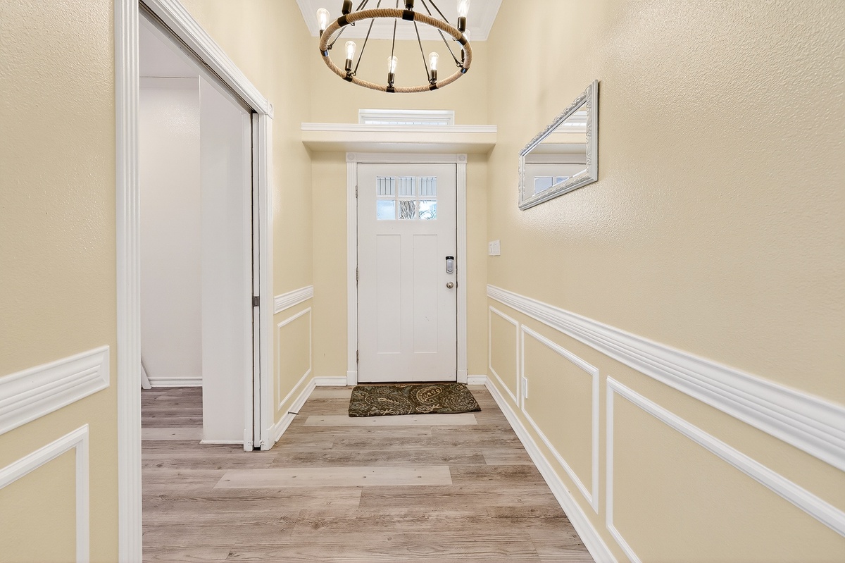 Step through your welcoming entrance into elegant hardwood floors and classic wainscoting that sets the tone for your refined getaway.