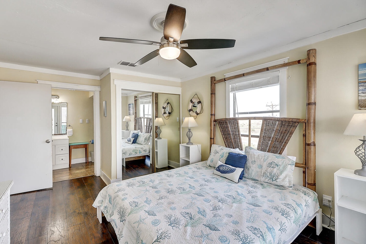Drift off in your coastal-themed bedroom with bamboo headboard, sea-inspired linens, and gentle ceiling fan breeze.