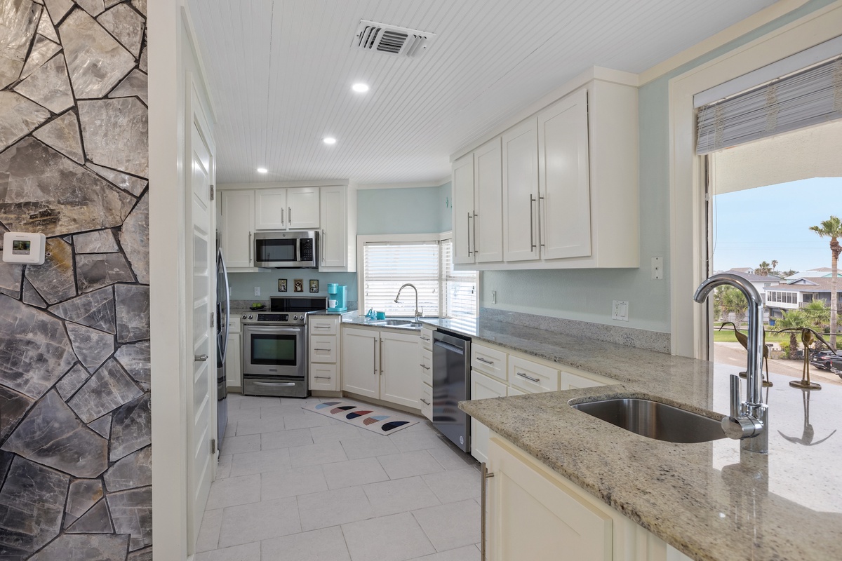 Your fully equipped kitchen features granite counters, stainless appliances, and everything you need to prepare memorable meals during your stay.