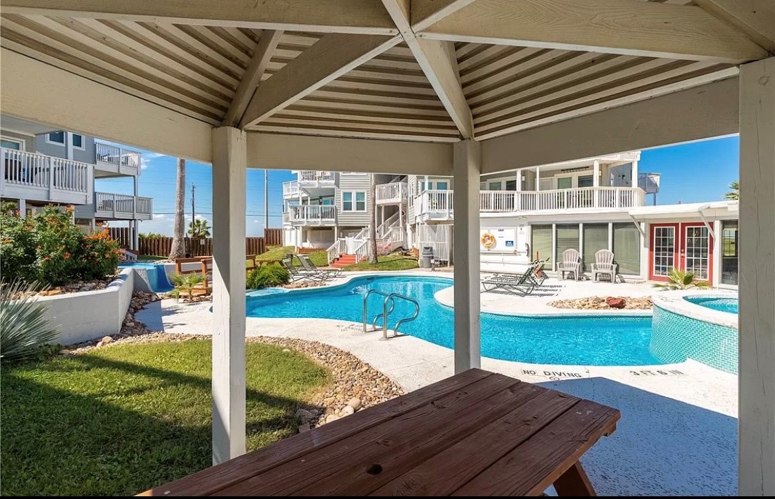 Relax under your private pavilion with stunning pool views, where cool shade meets sparkling water for perfect poolside lounging.