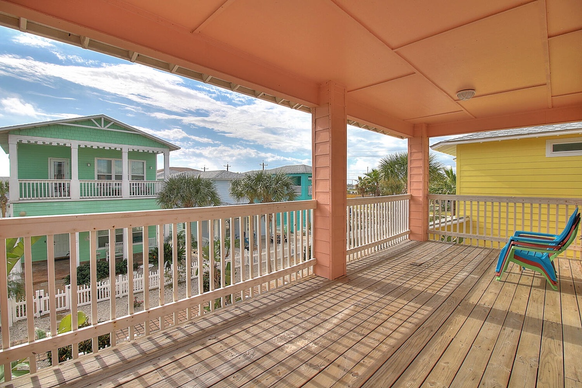 Relax on your spacious covered deck and soak up colorful coastal neighborhood views from your beach retreat.
