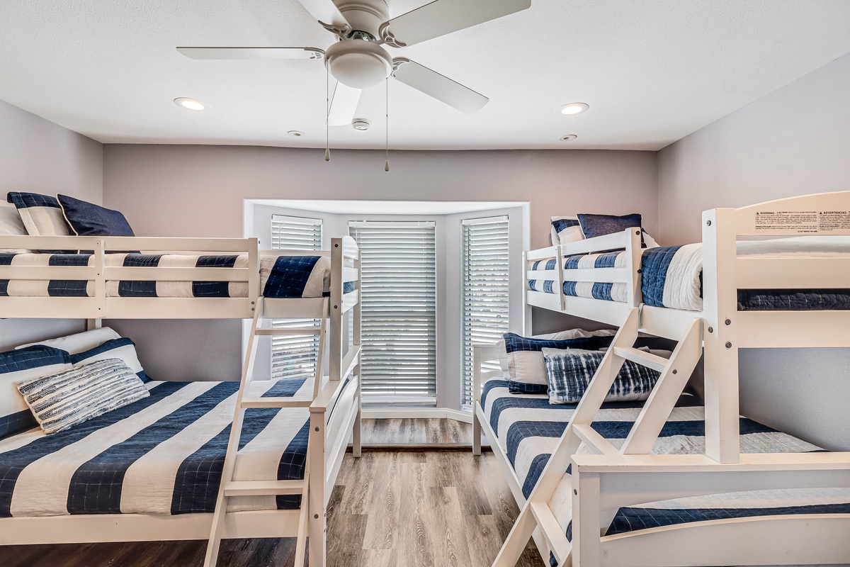 Your kids will love this fun bunk room where bedtime becomes an adventure. Cozy navy bedding and soft lighting create the perfect space for sweet dreams.
