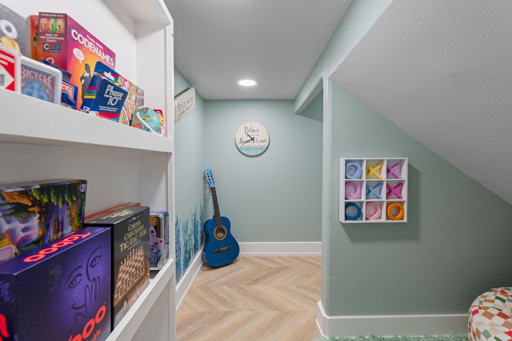 Your private game room awaits with board games, guitar, and cozy seating for endless entertainment and relaxation.