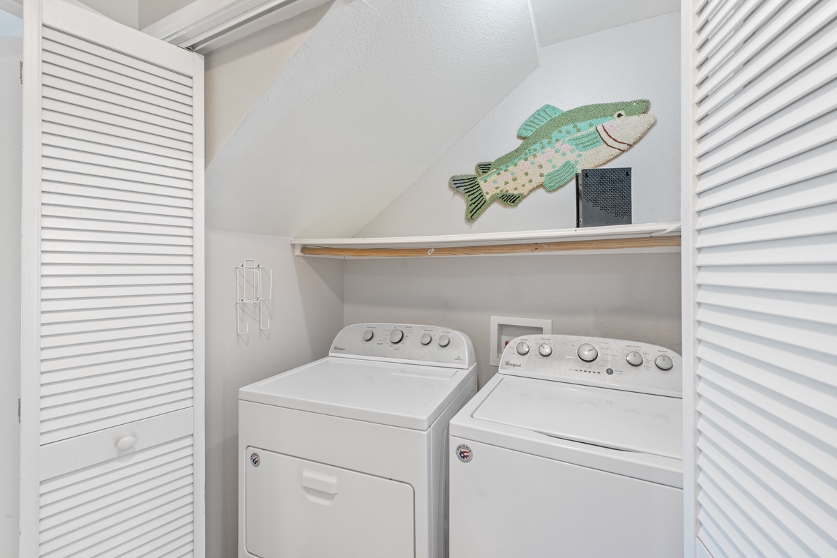 Your private laundry room keeps beach clothes fresh with full-size washer and dryer, plus coastal charm.