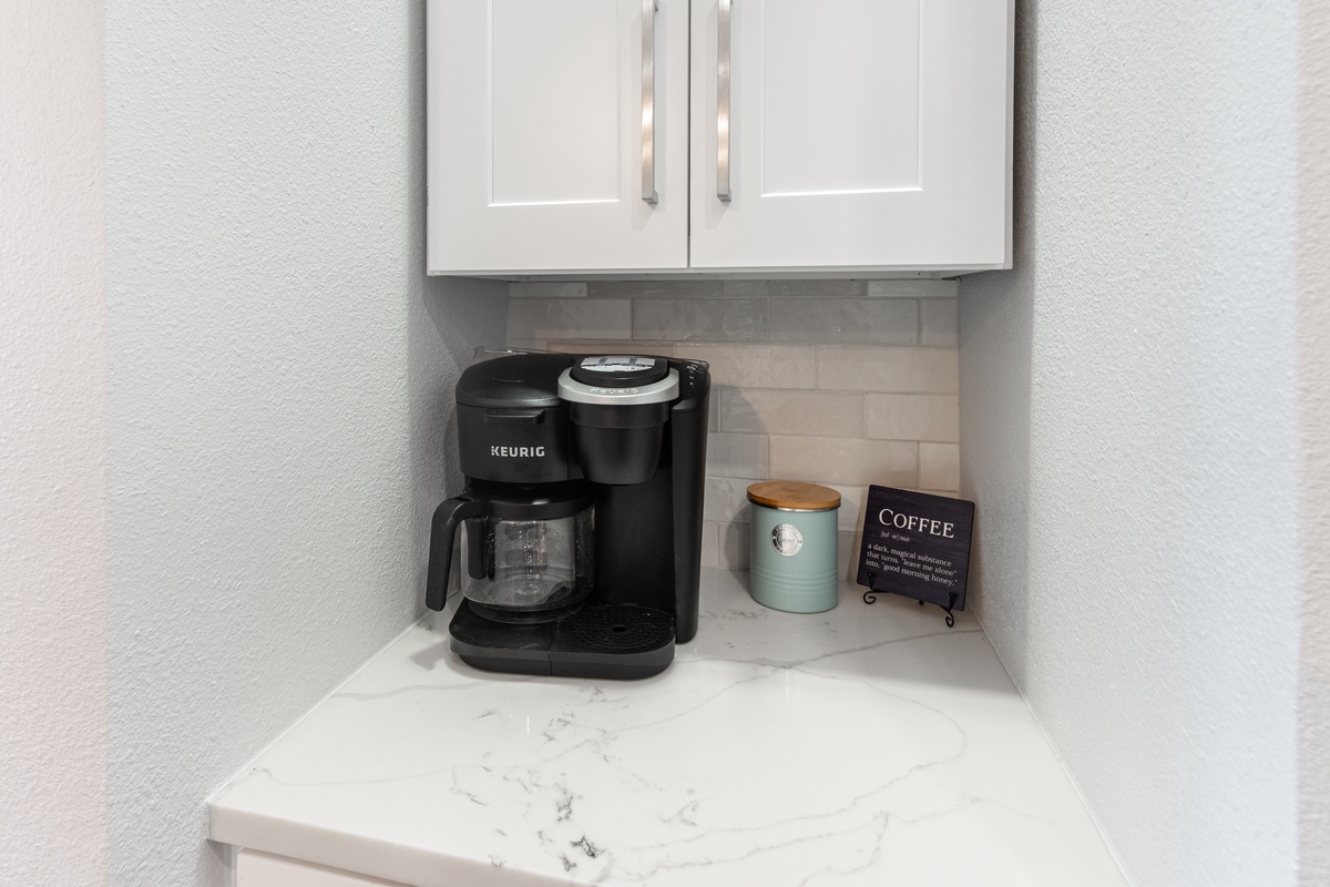 Start your mornings right with your own coffee station, complete with Keurig maker and premium supplies for that perfect cup.