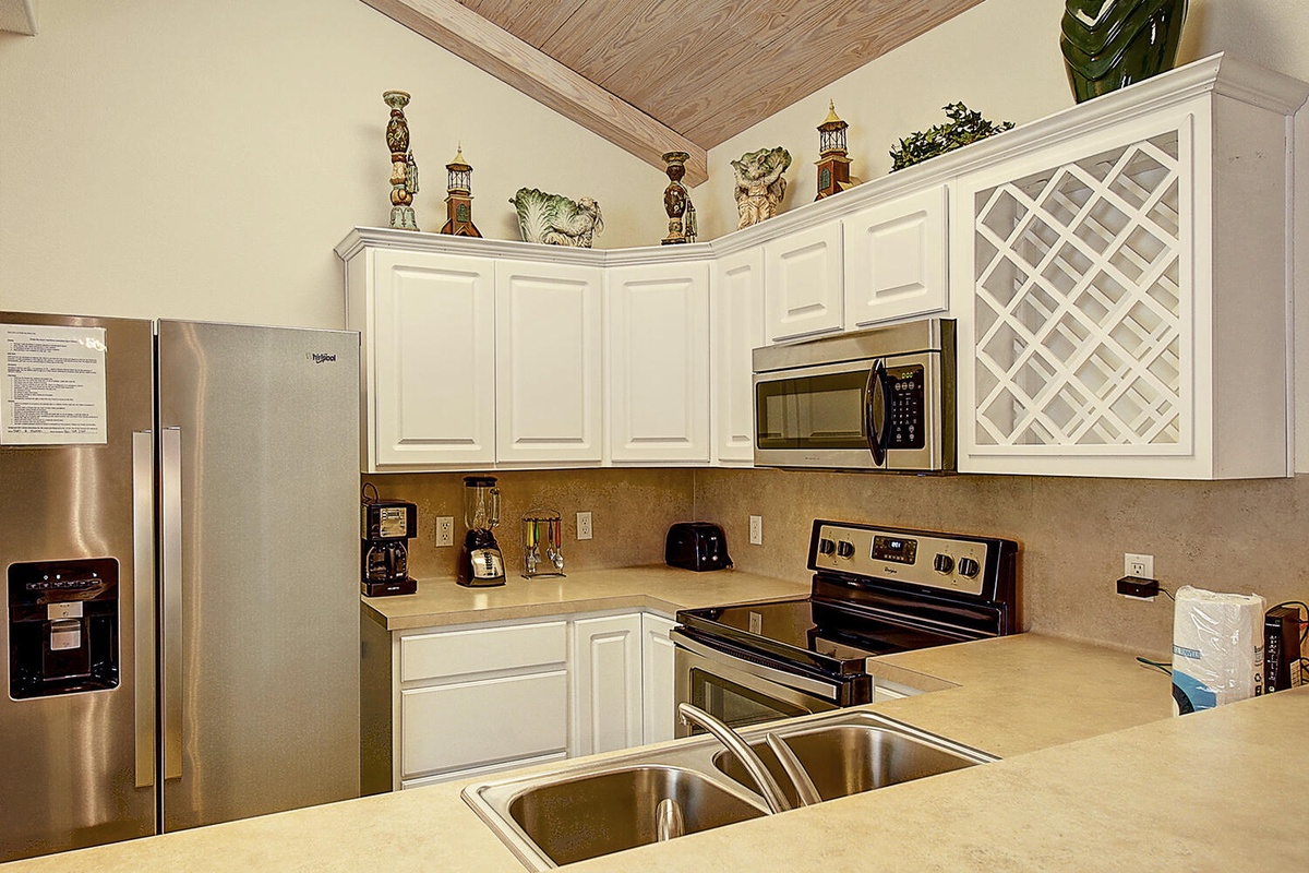 Your fully-equipped kitchen awaits with stainless steel appliances, ample counter space, and thoughtful touches for creating memorable meals together.
