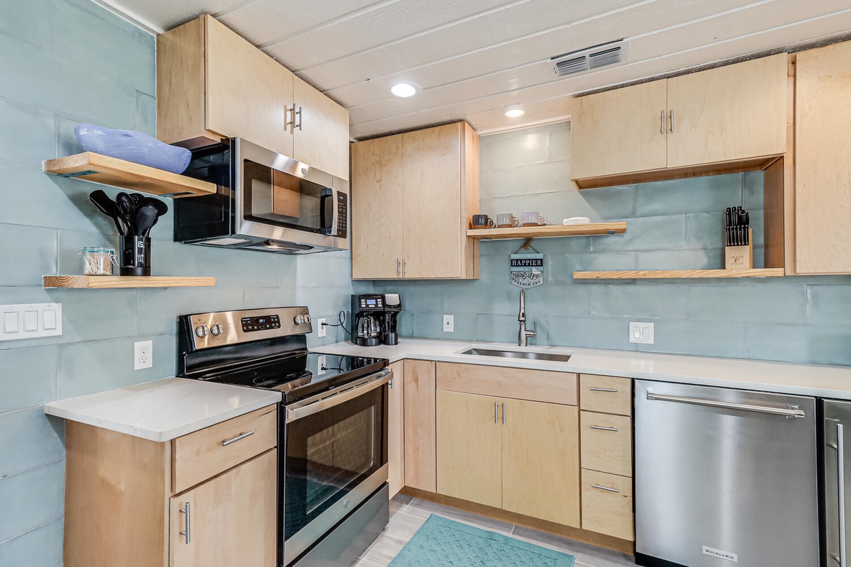 Your modern kitchen features stainless steel appliances and spacious countertops, perfect for preparing your favorite meals during your stay.