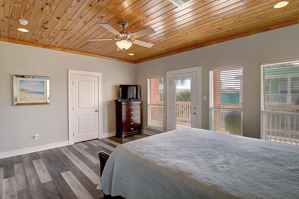 Drift off beneath soaring wood-panked ceilings in your serene bedroom, where French doors open to your private balcony and ocean breezes flow through.