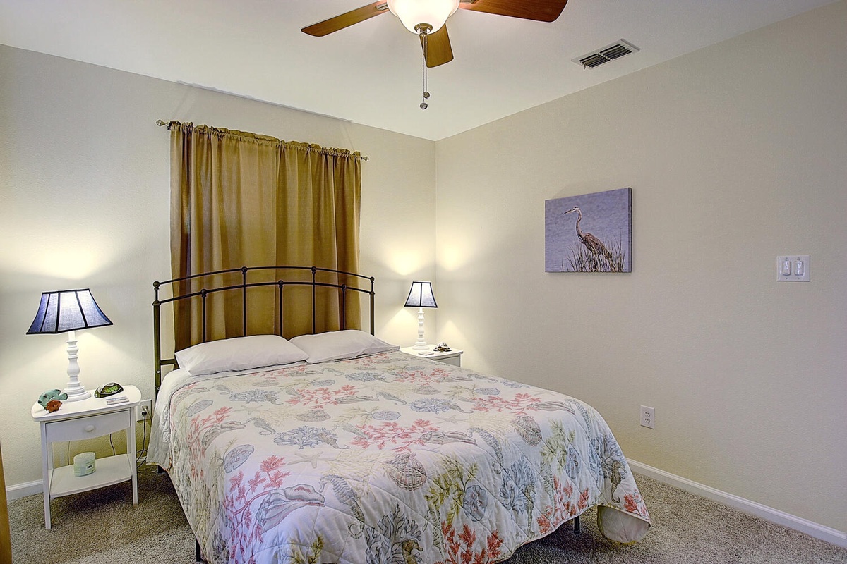 Drift off in your cozy bedroom where soft lighting and gentle ceiling fan create the perfect temperature for restful nights.