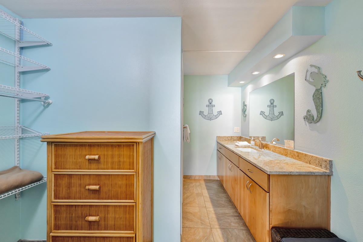 Freshen up in your coastal-themed bathroom with nautical touches, granite counters, and organized storage for all your beach vacation essentials.