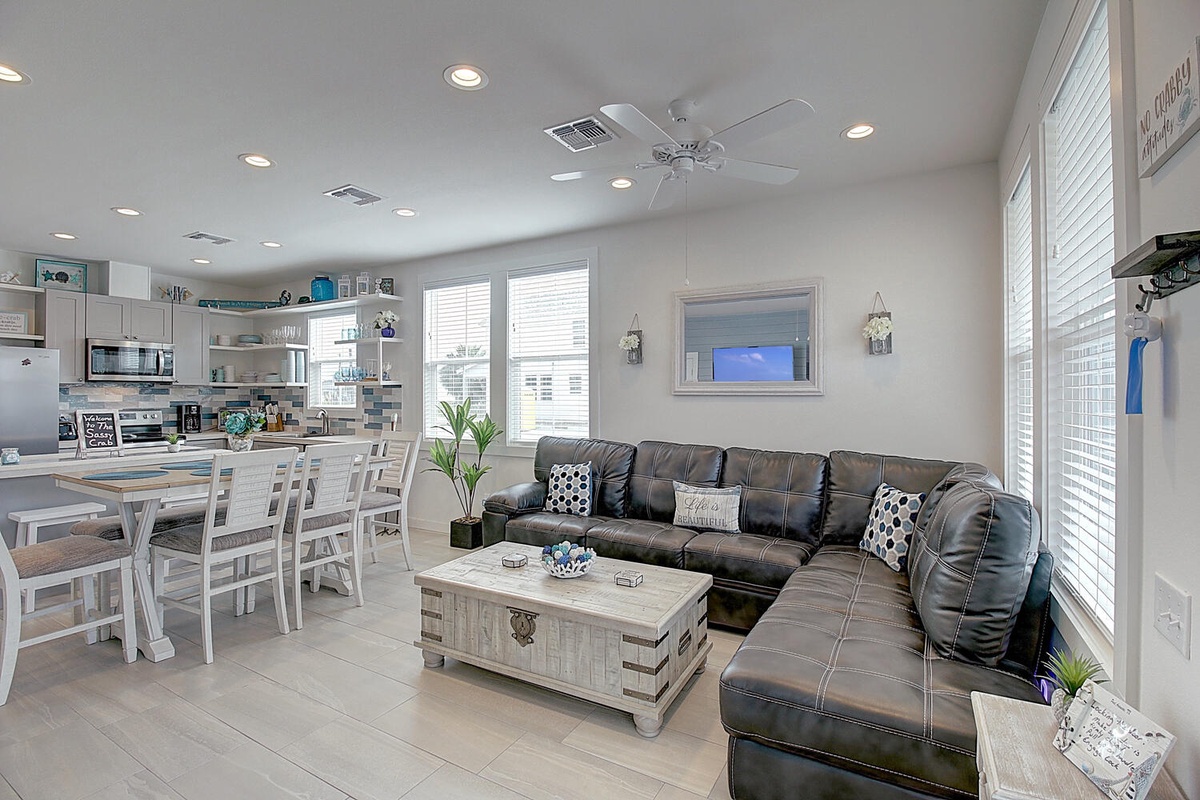 Unwind in your bright, modern living space with plush leather seating and open-concept dining perfect for vacation memories.