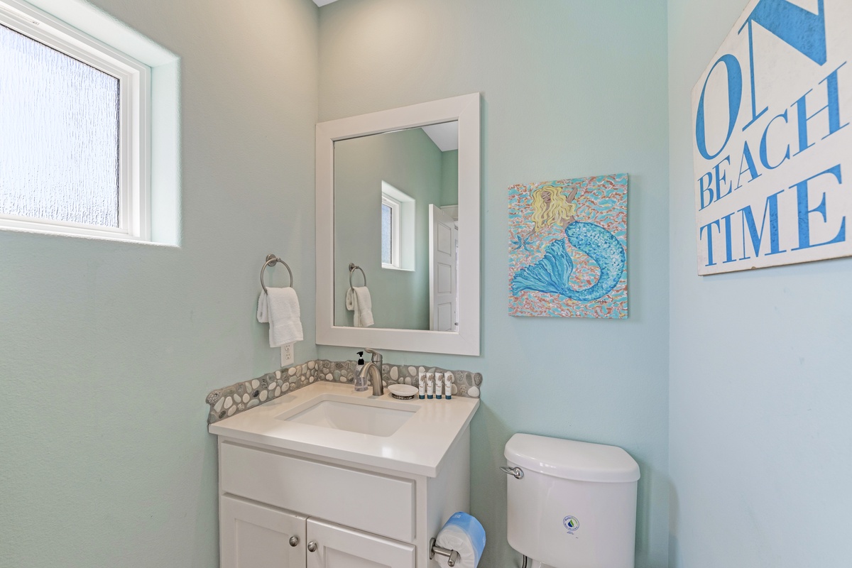 Just steps from the pool, this cheerful half bath makes quick pit stops easy so you can get right back to the fun in the sun!