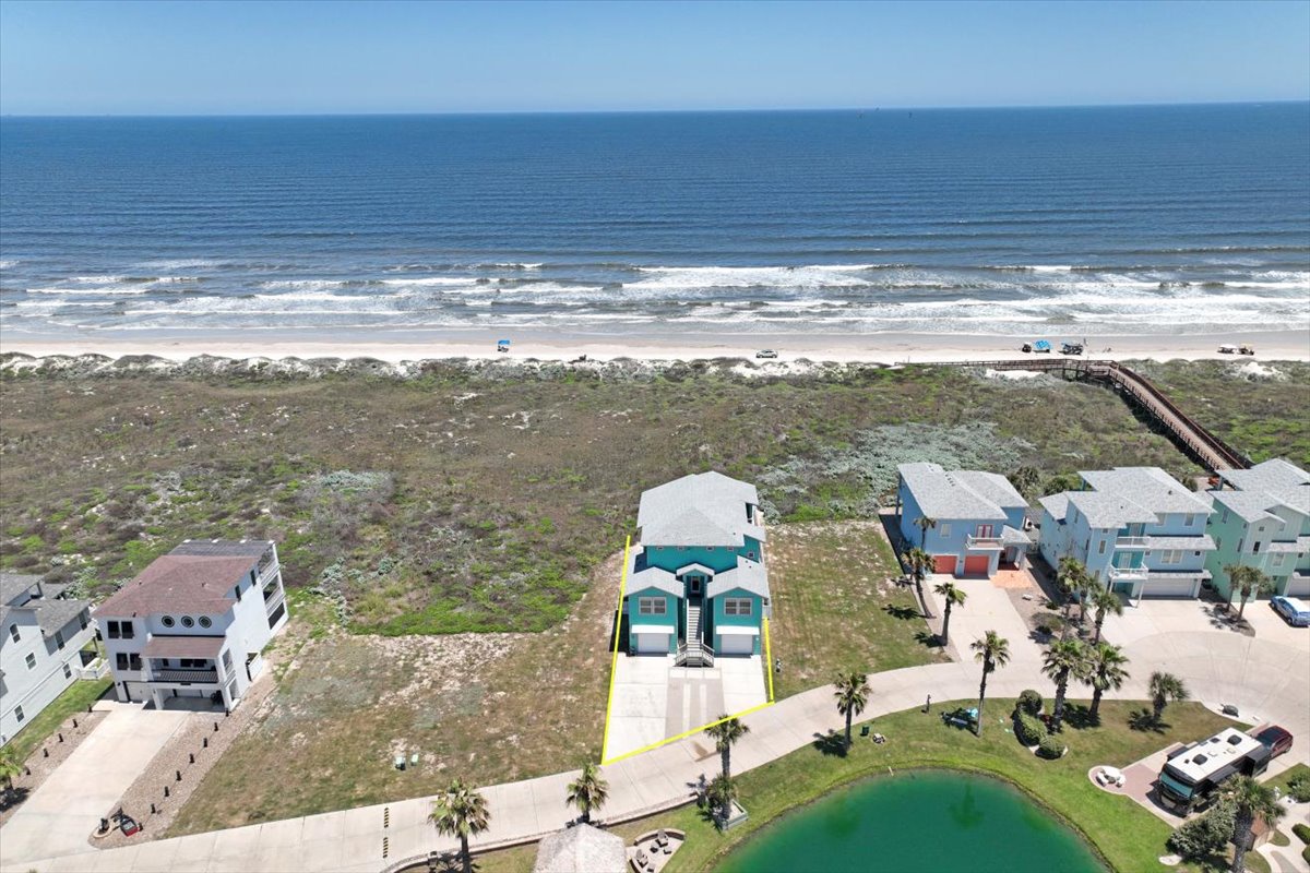 Beachfront property with direct beach access and coastal views in a residential neighborhood.