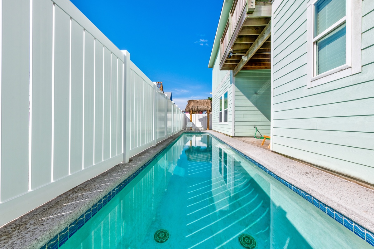 Dive into your private oasis where turquoise waters beckon beneath Florida's endless blue sky, creating perfect moments of pure relaxation.