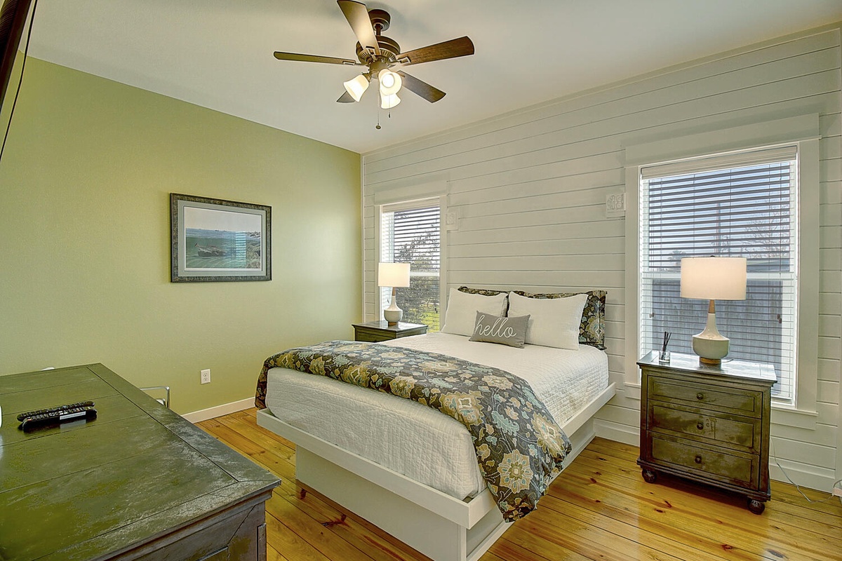 Sink into your cozy retreat with warm green walls, charming shiplap, and thoughtful touches that welcome you home.